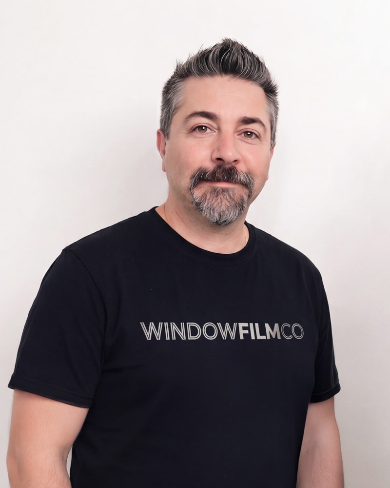 Morice Kastoun in a WindowFilmCo shirt, photographed against a plain pale wall.